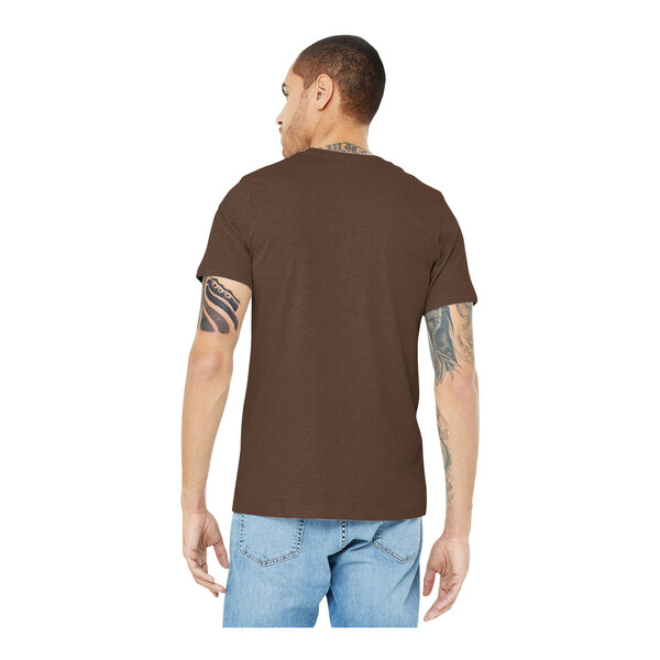 A man wearing a Bella + Canvas heather brown T-shirt and jeans.