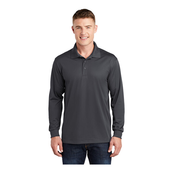 A man wearing a Sport-Tek iron gray long sleeve polo shirt.