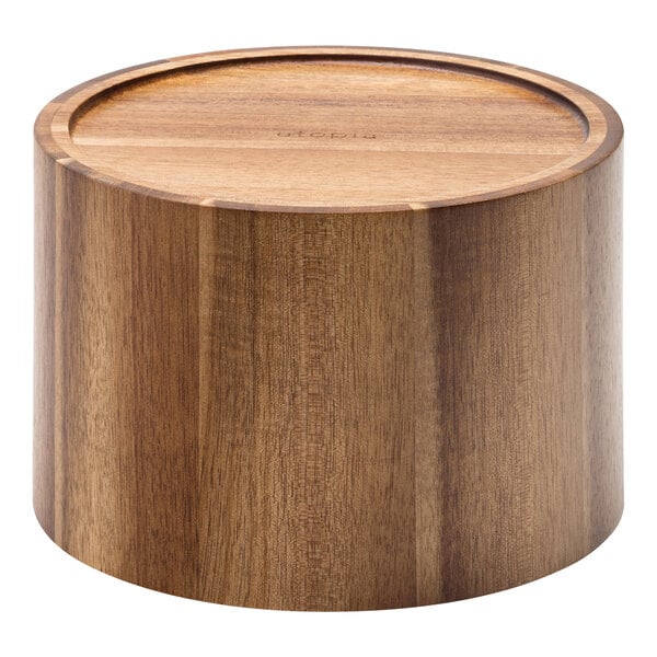 A round wooden cylinder with a round lid.