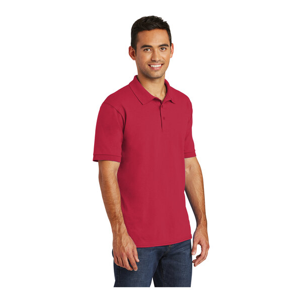 A man wearing a red Port & Company polo shirt.