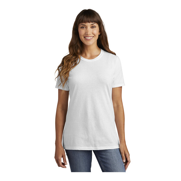A woman wearing a white Port & Company t-shirt.