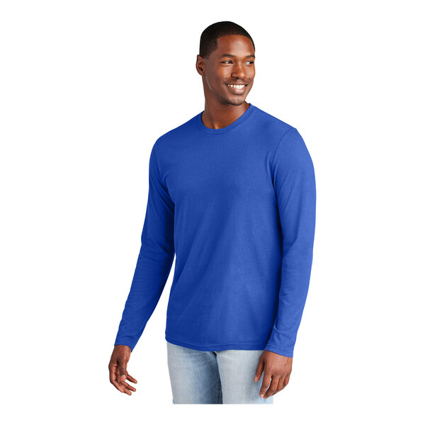A man wearing a medium deep royal blue District long sleeve t-shirt.