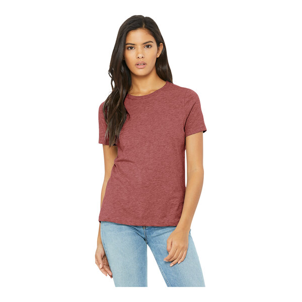 A woman wearing a Bella + Canvas heather mauve short sleeve t-shirt.