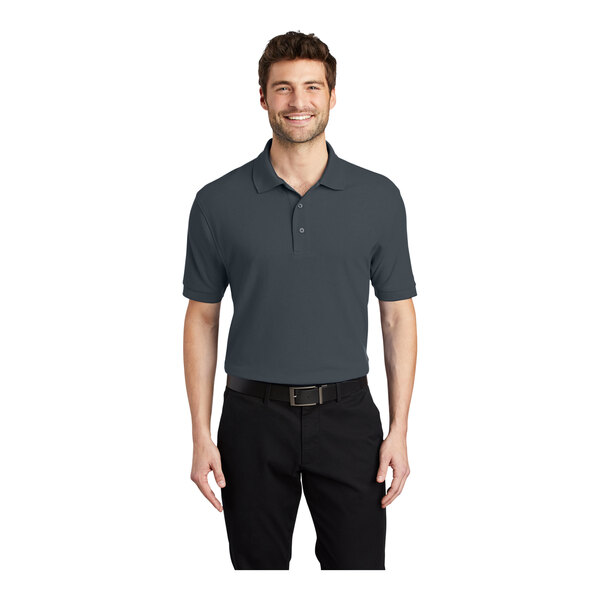 A man wearing a steel gray Port Authority silk touch polo shirt.