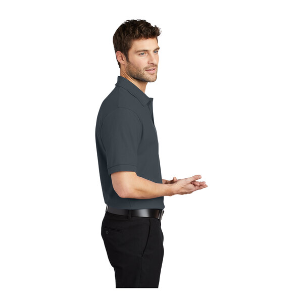 A man wearing a steel gray Port Authority silk touch pique polo.