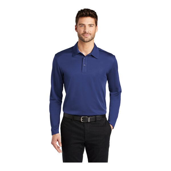 A man wearing a royal blue Port Authority long sleeve polo shirt.