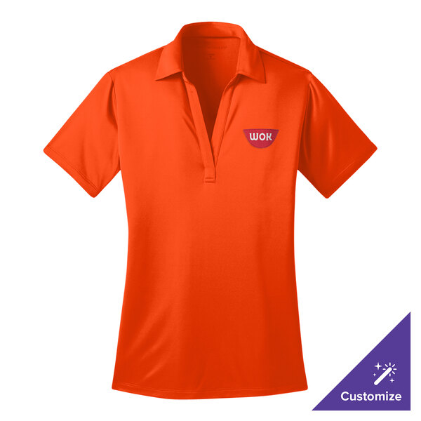 A small women's neon orange Port Authority polo shirt with a logo on it.