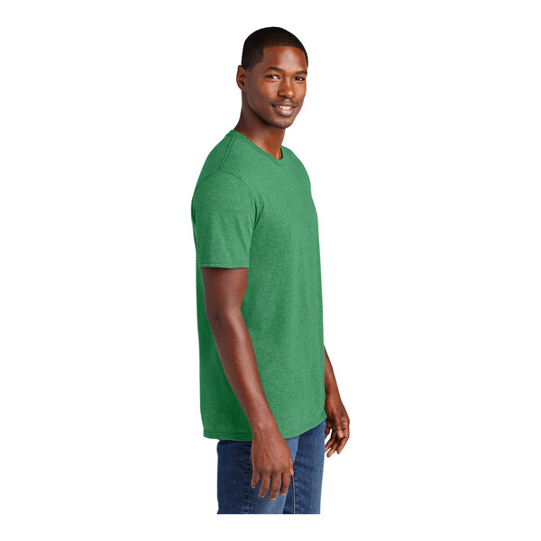A man wearing a District Heathered Kelly Green T-shirt.