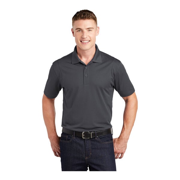 A man wearing an iron gray Sport-Tek short sleeve polo.