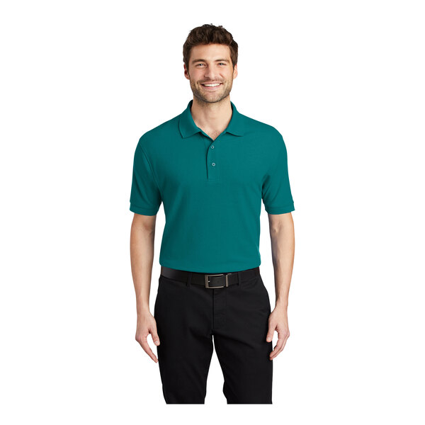 A man wearing a teal green Port Authority® Silk Touch™ Pique Polo shirt.