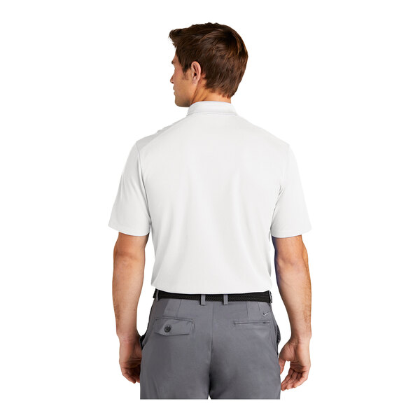 A man wearing a white Nike polo shirt.