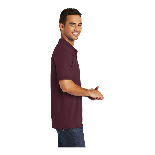 A man wearing a Port & Company maroon jersey polo shirt.