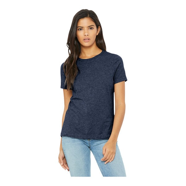A woman wearing a Bella + Canvas heather navy blue customizable t-shirt.