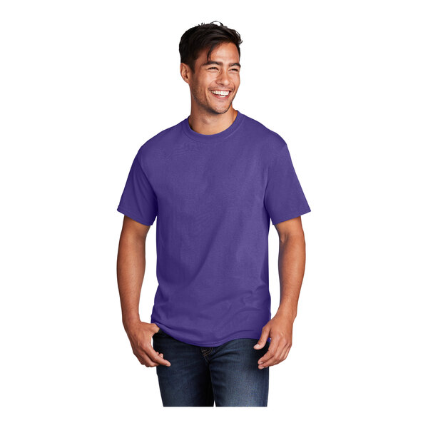 A man wearing a purple Port & Company short sleeve t-shirt.