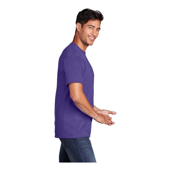 A man wearing a purple Port & Company T-shirt smiling.