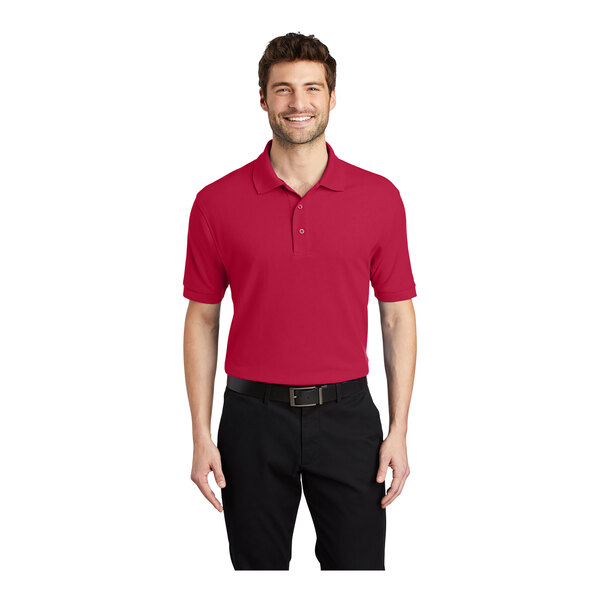 A man wearing a red Port Authority® silk touch polo shirt.