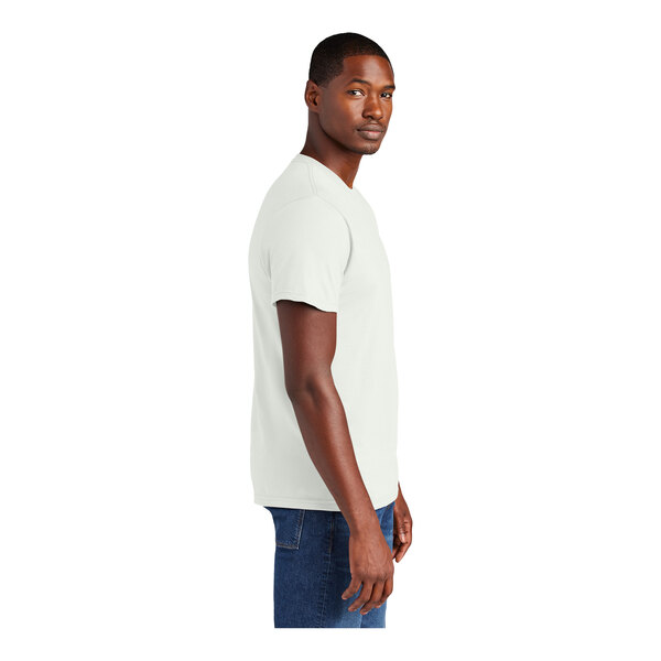 A man wearing a white District T-shirt.