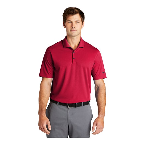 A man wearing a red Nike Dri-Fit polo shirt.