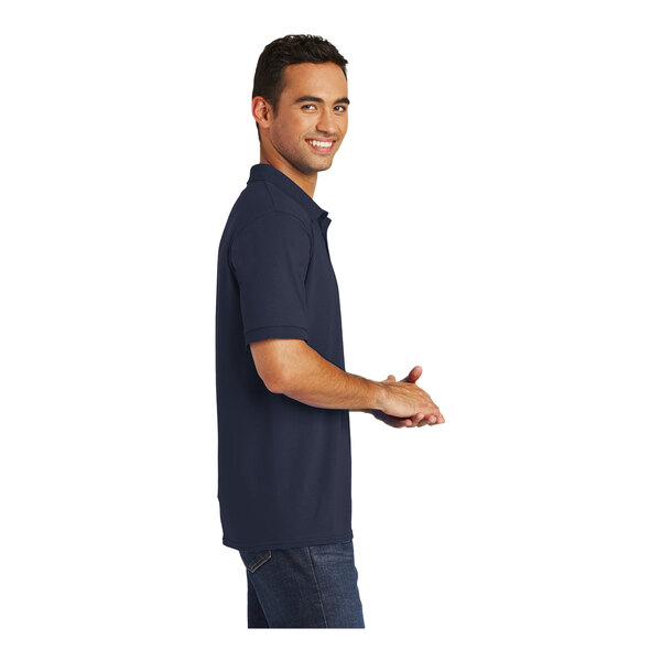A man wearing a Port & Company deep navy polo shirt.