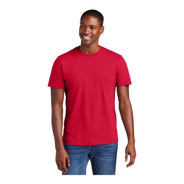 A man wearing a District® classic red short sleeve t-shirt.