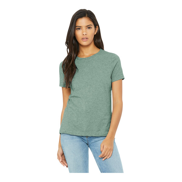 A woman wearing a Bella + Canvas heather prism dusty blue short sleeve t-shirt.