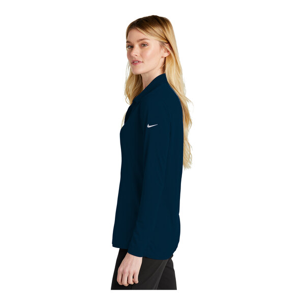 A navy Nike long sleeve polo shirt.