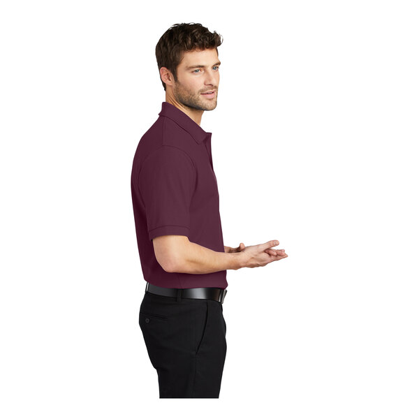 A man wearing a maroon Port Authority® Silk Touch™ Pique Polo Shirt.