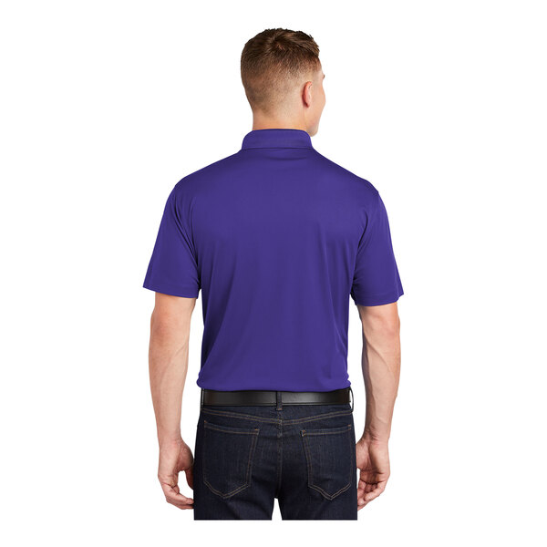 A man wearing a purple Sport-Tek short sleeve polo shirt.