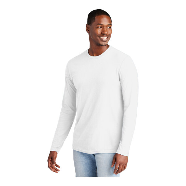 A man wearing a white District long sleeve t-shirt.