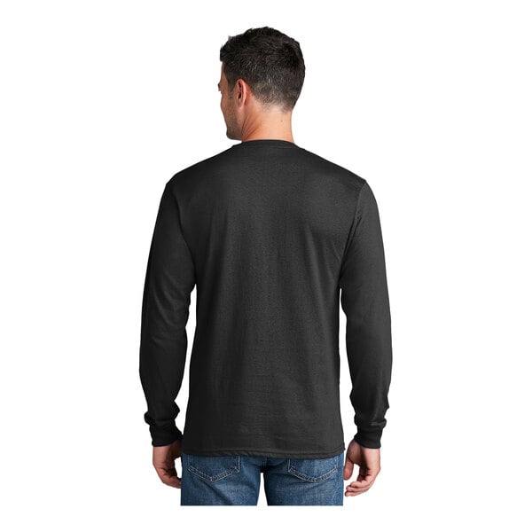A man wearing a Port & Company black long sleeve t-shirt.