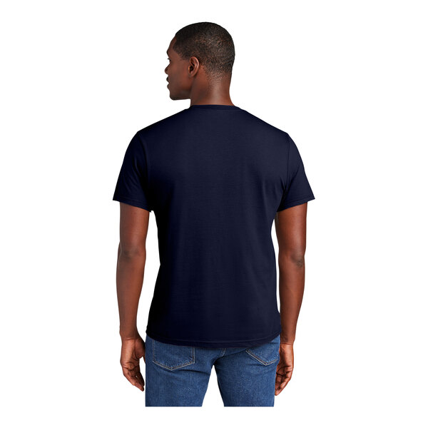 A man wearing a navy District t-shirt.