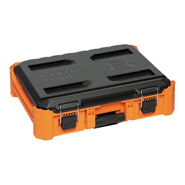 A black and orange Klein Tools MODbox small toolbox on a table.