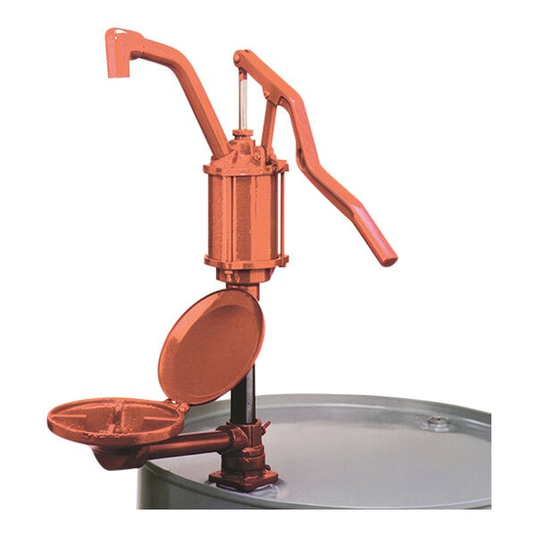 A Wesco cast iron and steel lever drum pump with a metal bowl.