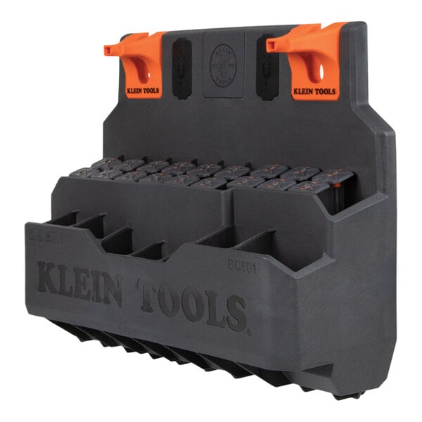 A Klein Tools hard tool storage module with black and orange handles.