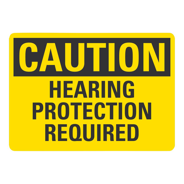 A yellow and black rectangular aluminum safety sign that says "Caution Hearing Protection Required"