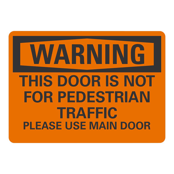 A white plastic sign with black text that reads "Warning This Door Is Not For Pedestrian Traffic Please Use Main Door"