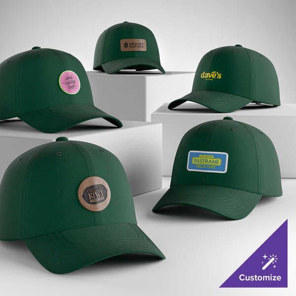 A collection of customizable dark green unstructured low profile dad caps with various logo designs on the front.
