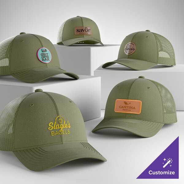 A collection of olive drab green 6-panel trucker caps with mesh backs, each featuring customizable front patches or embroidery.