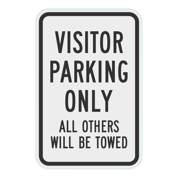 A white rectangular Lavex parking sign with black text that says "Visitor Parking Only / All Others Will Be Towed"