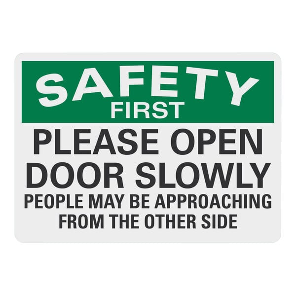 A white rectangular Lavex adhesive vinyl safety label with black text reading "Safety First / Please Open Door Slowly"