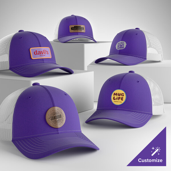 A customizable purple and white 6-panel trucker cap with a mesh back and various logo patches on the front.