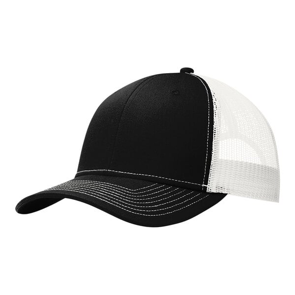 A black and white Port Authority trucker cap with white mesh on the front.