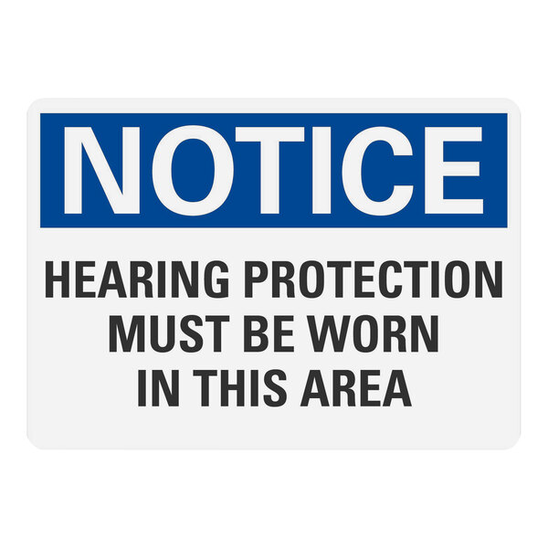 A blue and white sign with white letters that says "Notice Hearing Protection Must Be Worn In This Area"