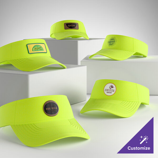A collection of customizable neon yellow visors displayed on white blocks.