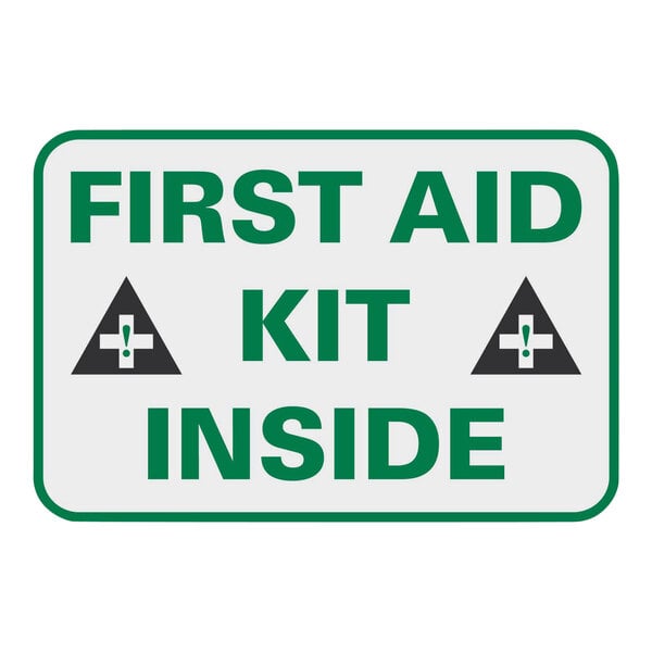 A white sign with green text that says "First Aid Kit Inside" above a green cross.