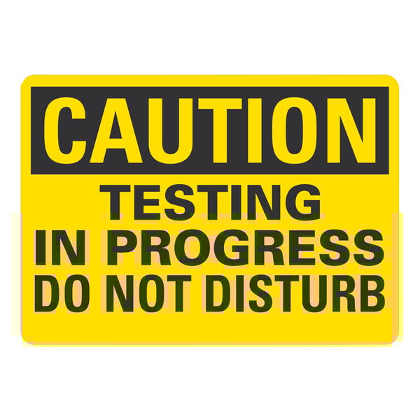 A yellow and black Lavex aluminum safety sign that says "Caution / Testing In Progress / Do Not Disturb"