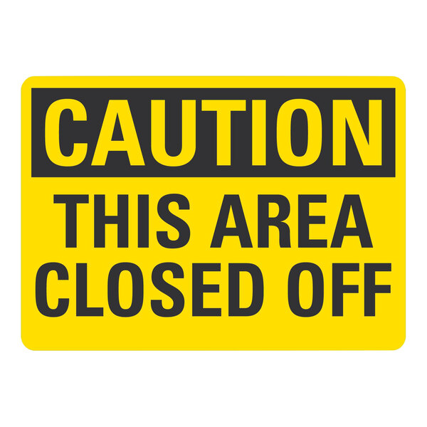 A white rectangular sign with yellow and black text that says "Caution / This Area Closed Off"