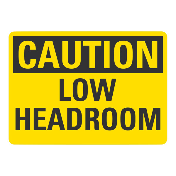 A yellow and black Lavex adhesive vinyl safety label that says "Caution / Low Headroom"