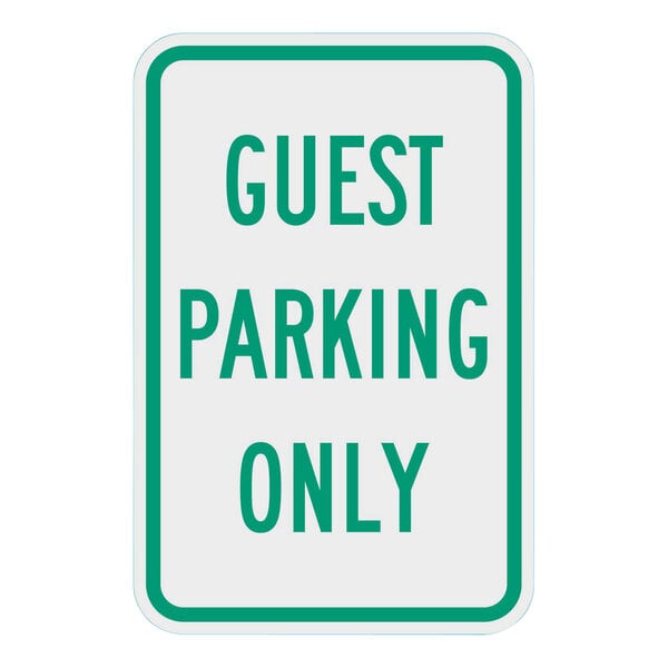 A white sign with a green border and green text that says "Guest Parking Only"