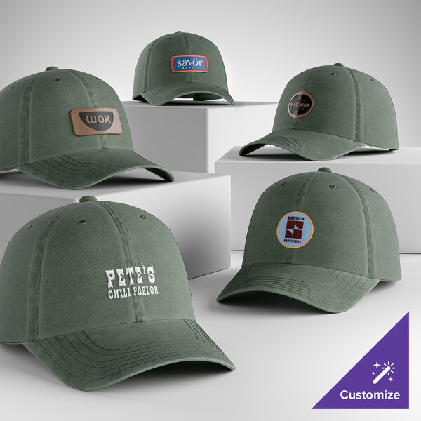 A collection of green, unstructured, low-profile, 6-panel dad caps with customizable front designs.